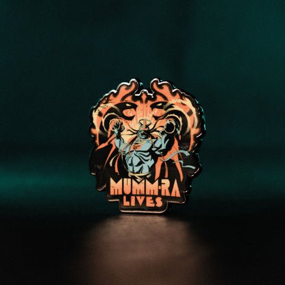 ThunderCats Mumm-Ra Lives pin badge, side-lit angled shot on a dark background