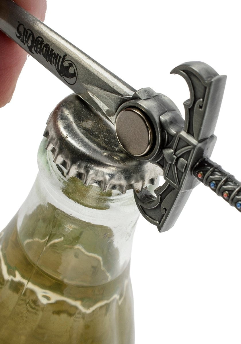 ThunderCats Sword of Omens bottle opener popping the cap off a glass bottle
