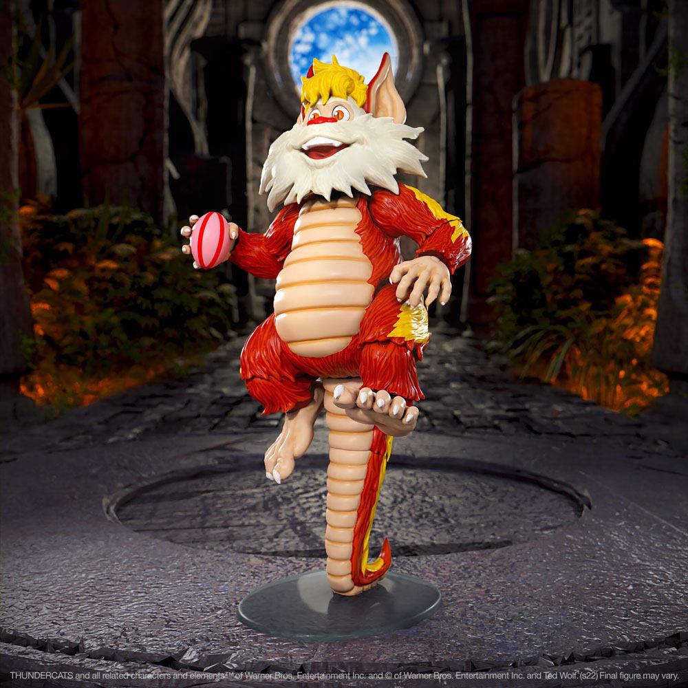 Super7 ThunderCats Ultimates Snarf posed standing on his tail holding a piece of fruit