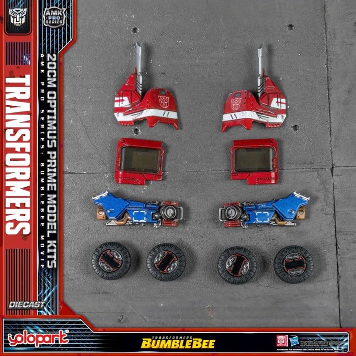Yolopark Optimus Prime kit parts laid out: shoulder armour, chest windows, arm panels and wheels