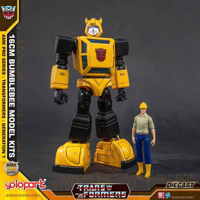 Front view of the built Yolopark G1 Bumblebee kit beside a human figure in a hard hat
