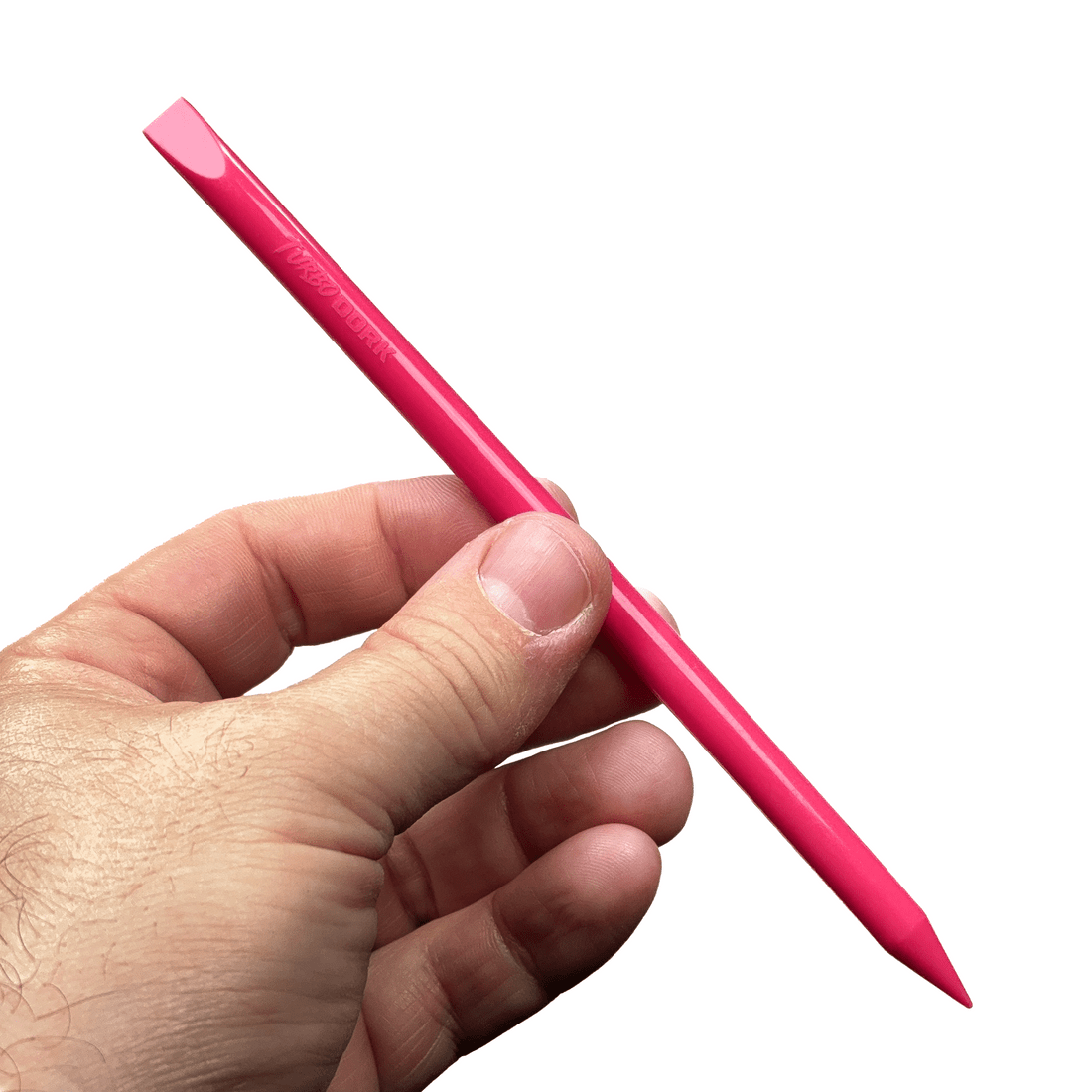 Hand holding a pink Turbo Dork silicone mixing stick showing its flat angled tip