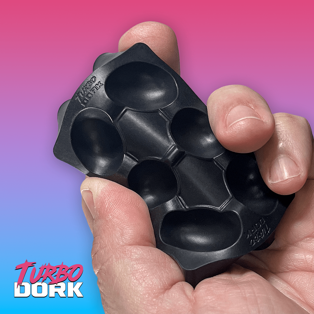 Turbo Dork black silicone dry palette flexed in the hand to show it bends