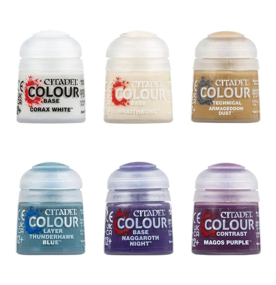 Six Citadel Colour paint pots from the Tyranids set, including Corax White and Magos Purple