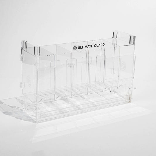 Ultimate Guard acrylic dispenser base for TCG booster packs, empty clear dispenser, front three-quarter view