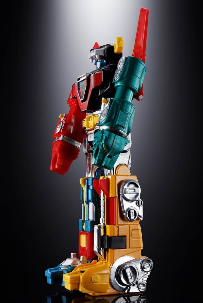 Chogokin Voltron figure, left side view showing the red lion arm and yellow lion leg