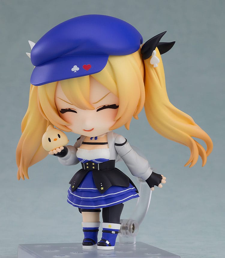 Close-up of the Dokibird Nendoroid laughing with eyes shut, holding the small yellow chick