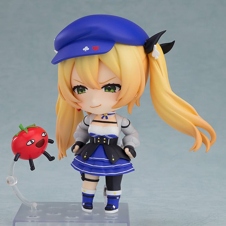 Dokibird Nendoroid with arrogant grin, tomato figure mounted on a clear stand arm beside her