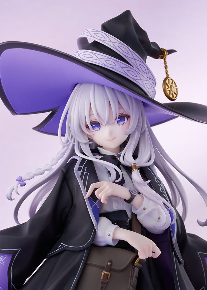 Close-up of Elaina figure's smiling face, witch hat with gold brooch and leather satchel