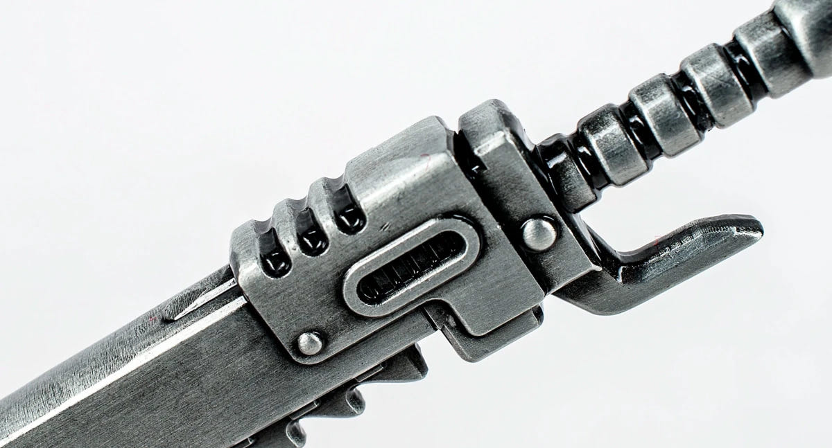 Close-up of the chainsword bottle opener housing and hilt detail