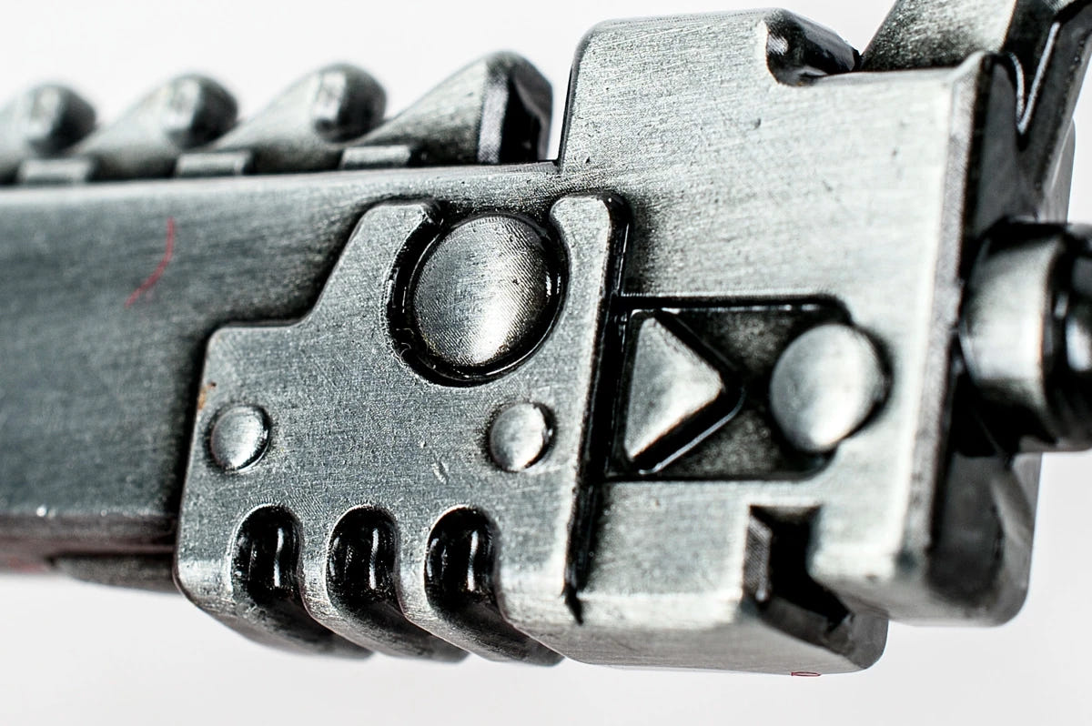 Close-up of the sculpted chainsword motor housing on the bottle opener