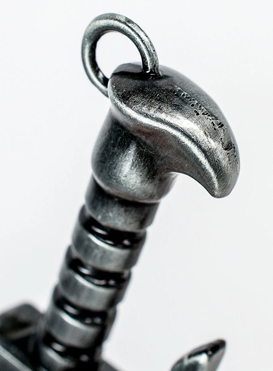 Close-up of the chainsword bottle opener pommel with hanging ring