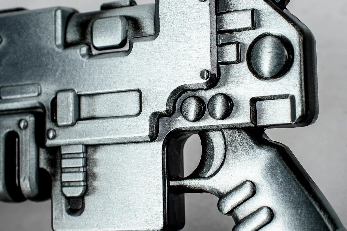 Close-up of the bottle opener's magazine and trigger guard detail