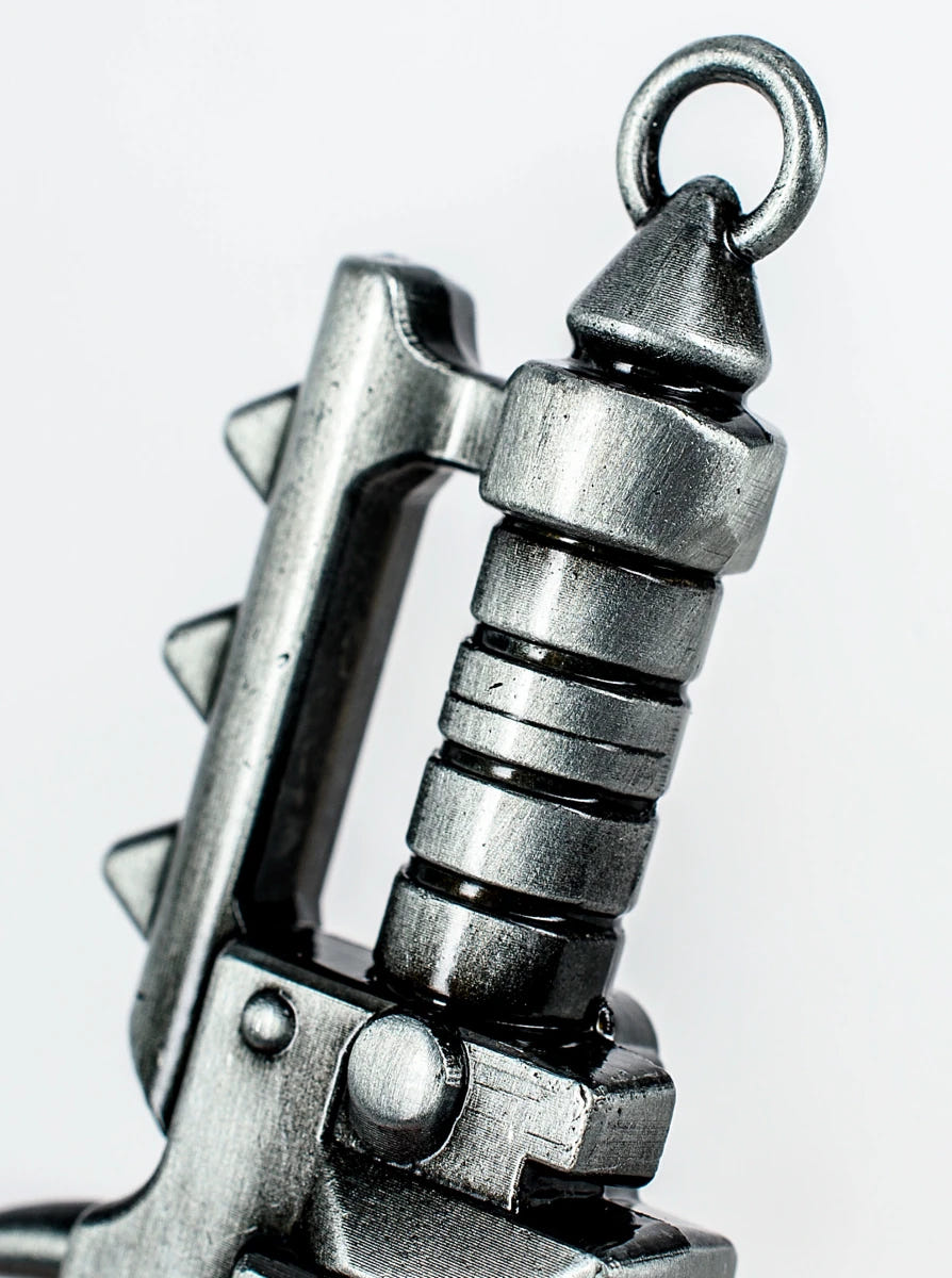 Close-up of the pommel ring and handle grip on the Chaos chainsword bottle opener