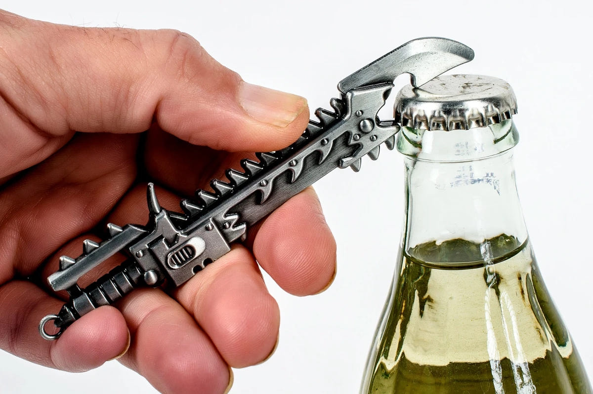 Warhammer 40,000 Chaos chainsword bottle opener in hand, opening a glass bottle