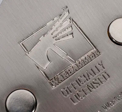 Close-up of the engraved Warhammer officially licensed mark on the bottle opener's back