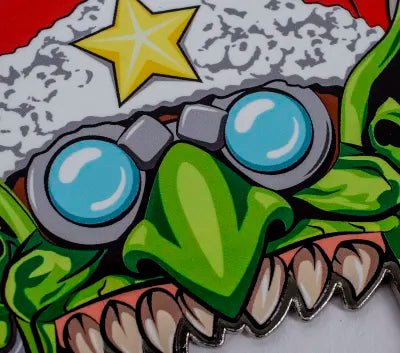 Close-up of Da Red Gobbo's goggles, green nose and Santa hat star on the bottle opener