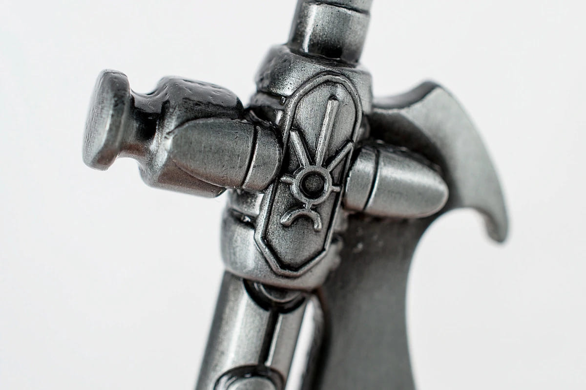 Necron Hyperphase Sword bottle opener, close-up of the crossguard with Necron glyph