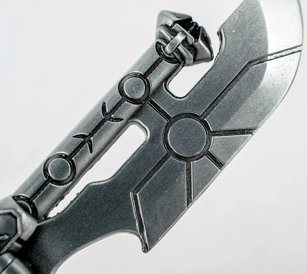 Necron Hyperphase Sword bottle opener, close-up of the blade's circular Necron engraving