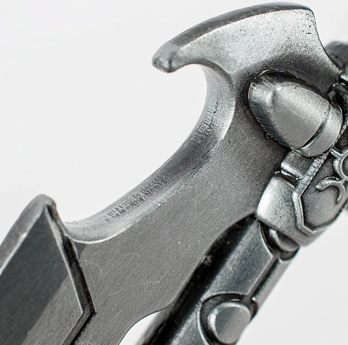 Necron Hyperphase Sword bottle opener, close-up of the opener notch beside the crossguard