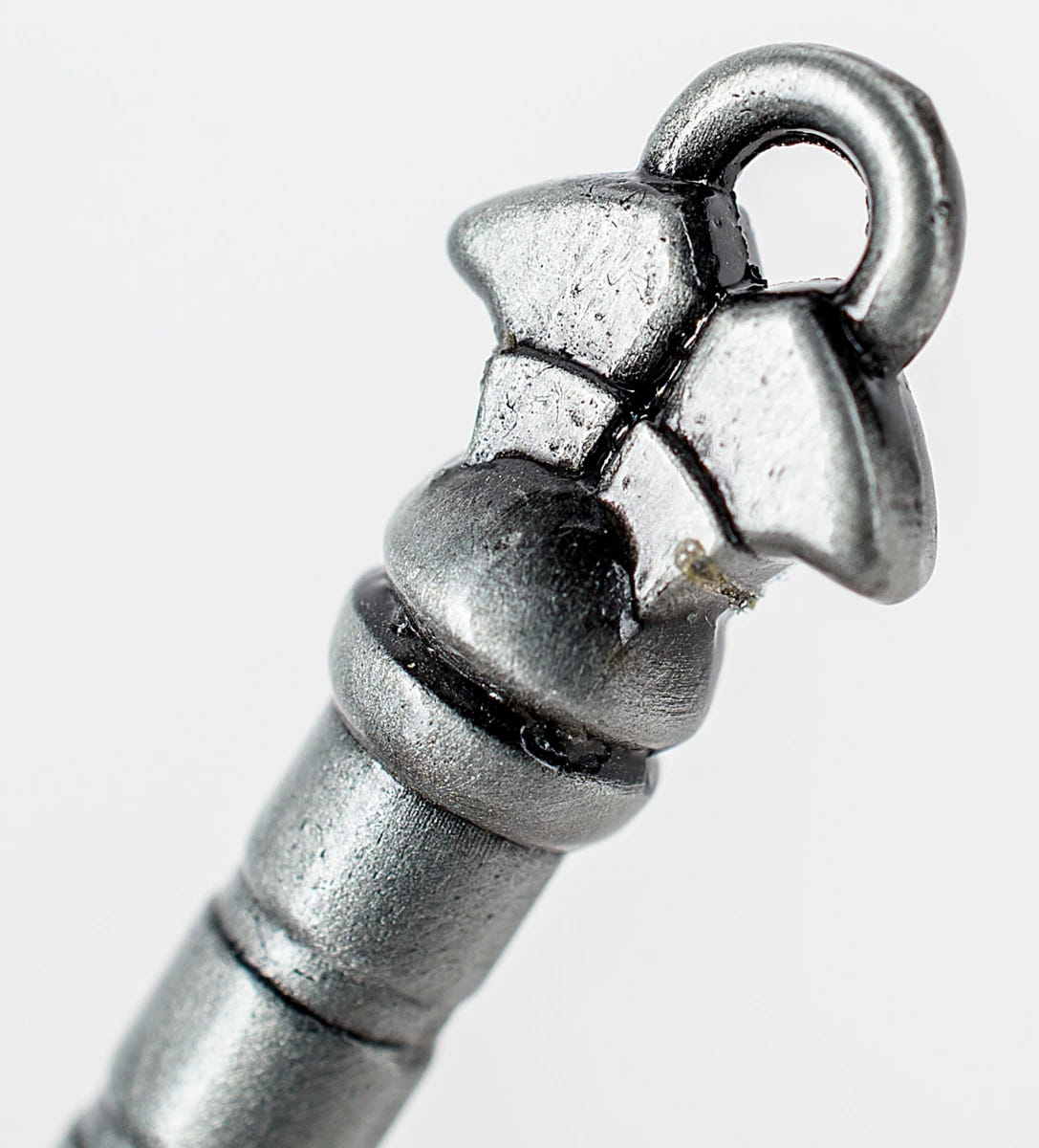 Necron Hyperphase Sword bottle opener, close-up of the pommel with its keyring loop