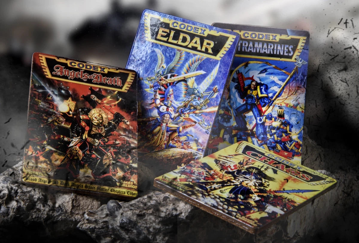 Four Warhammer 40,000 2nd Edition codex coasters: Angels of Death, Eldar, Ultramarines and Chaos covers