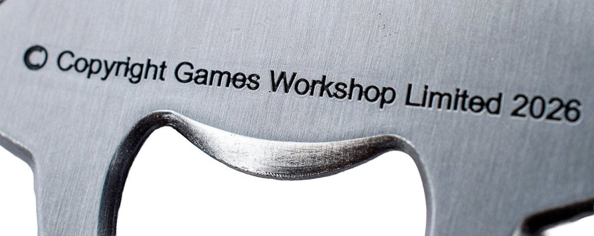 Close-up of the brushed metal opener on the back of the Servo Skull bottle opener
