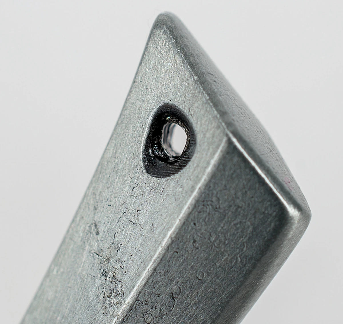 Close-up of the hanging hole at the tip of the Tyranid Bonesword bottle opener