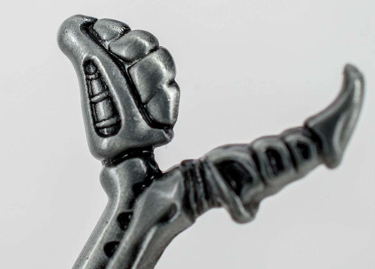 Close-up of the claw-like pommel on the Warhammer 40,000 Bonesword bottle opener
