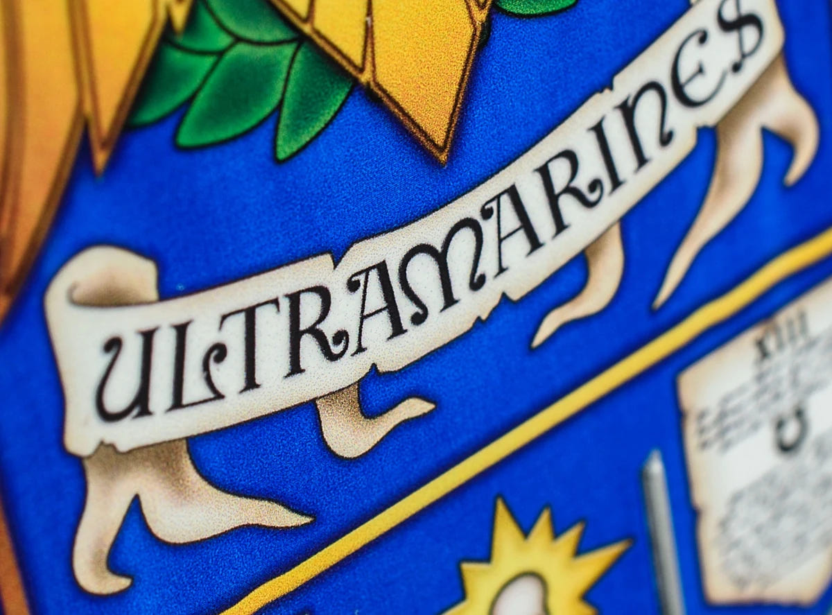 Close-up of the Ultramarines name scroll on the blue Chapter desk banner