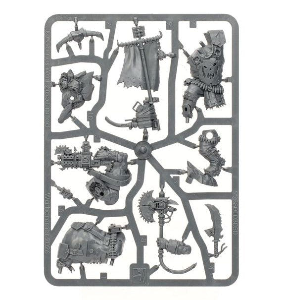 A gray plastic sprue containing multiple unpainted miniature figurines and accessories, isolated on a solid white background.