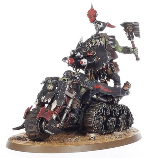 Detailed Ork Mininature on a motorcycle with a white background
