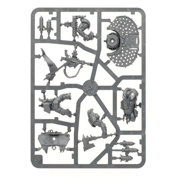 A gray plastic sprue containing multiple unpainted miniature model parts, isolated on a solid white background.