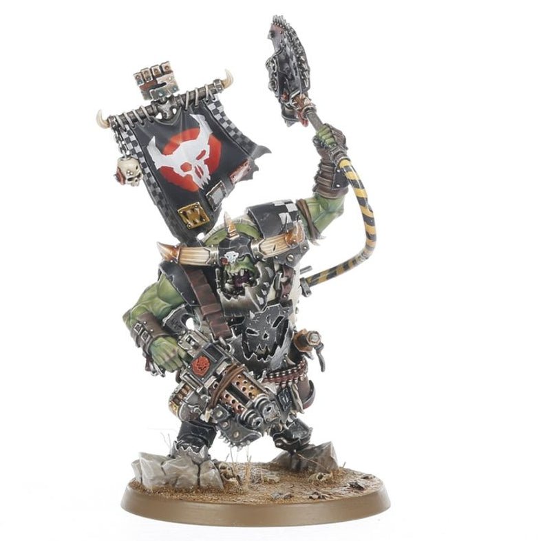 Warhammer figurine with detailed armor and weapon on a white background