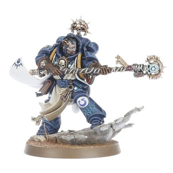 A painted miniature figurine of a skeletal warrior in blue armor holding a white banner and a large mace, standing on a rocky base against a plain white background.