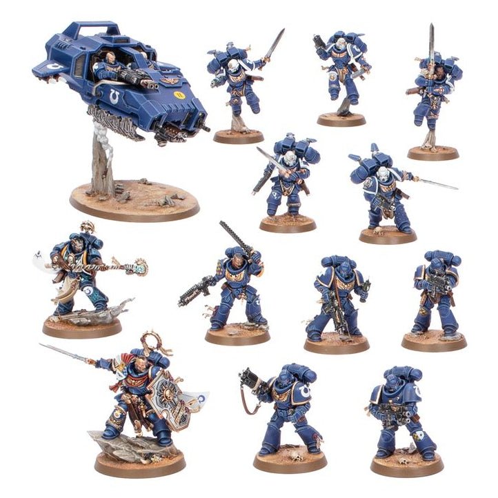 A set of painted miniature figurines and a vehicle, likely tabletop gaming miniatures, arranged on a plain white background. The figures are primarily blue with silver and white armor details, and most stand on round brown bases.
