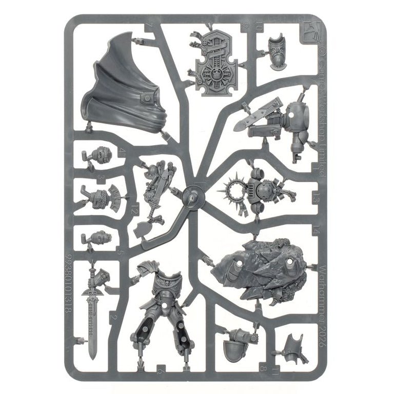 A gray plastic sprue containing multiple unpainted miniature terrain and armor parts, photographed on a plain white background.