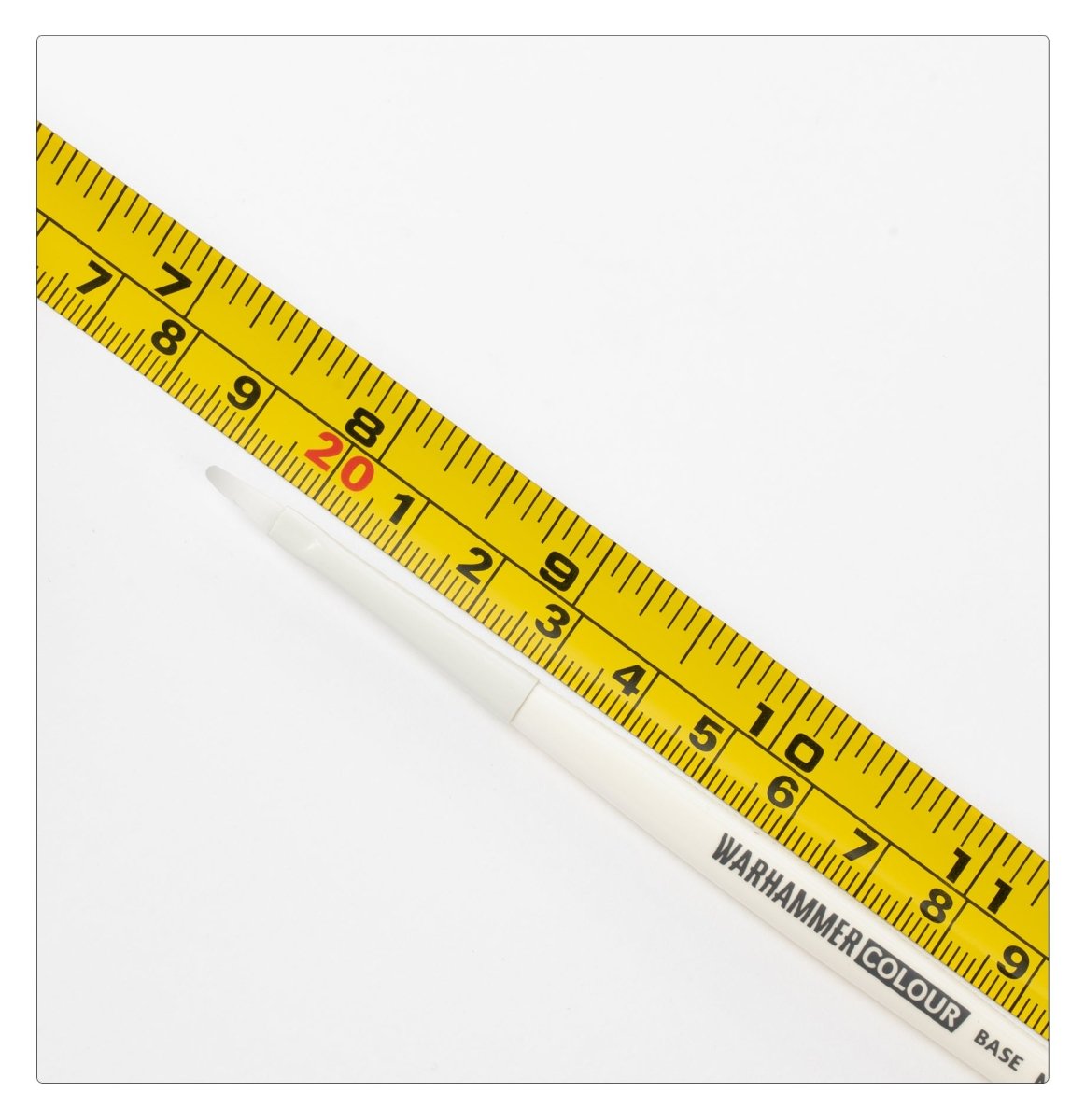 Warhammer Colour Base Brush (Medium) shown against a tape measure for size
