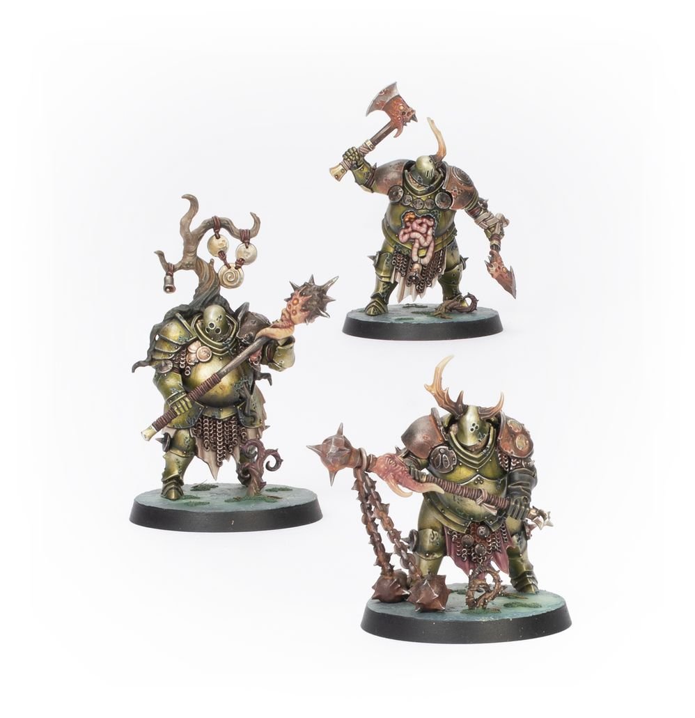 Three painted horned warriors with axes and flails from Games Workshop's Warhammer Quest: Darkwater