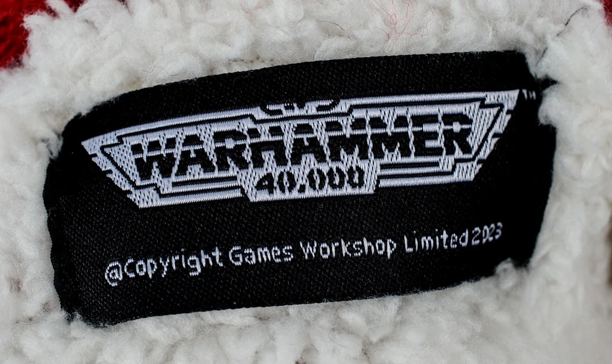 Warhammer 40,000 woven label on the sherpa lining of the Red Squig slipper socks
