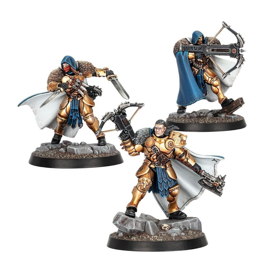 Three painted Emberwatch warriors in gold armour and blue hooded cloaks with crossbows and blades