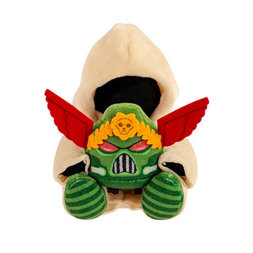 TOMY Warhammer Watcher in the Dark plush in a cream hood, holding a green Space Marine helmet