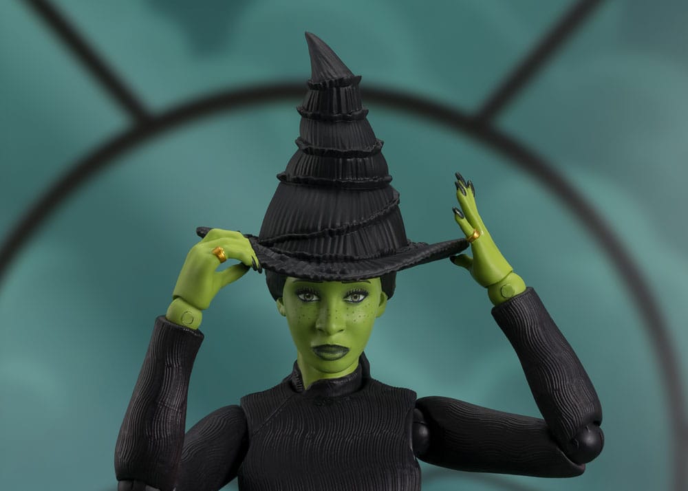 Close-up of the Wicked S.H.Figuarts Elphaba figure adjusting her pointed witch's hat
