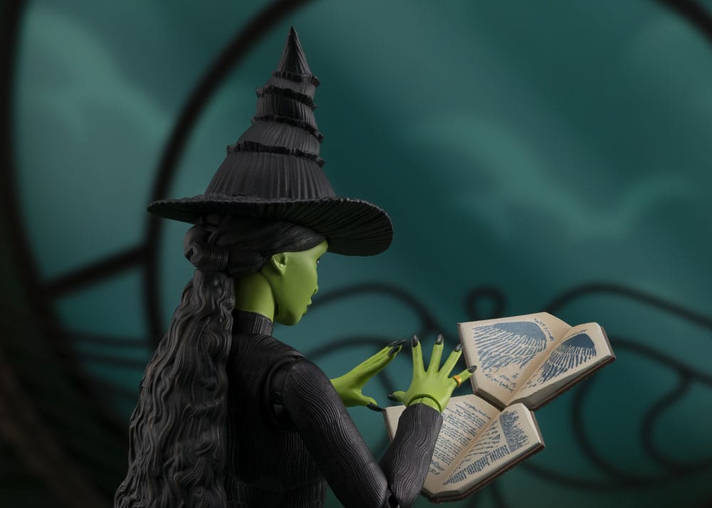 Wicked S.H.Figuarts Elphaba figure reading an open spell book, side view