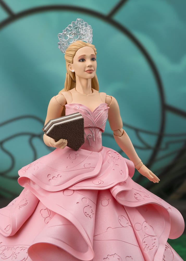 Wicked S.H.Figuarts Glinda figure holding a book, waist-up view