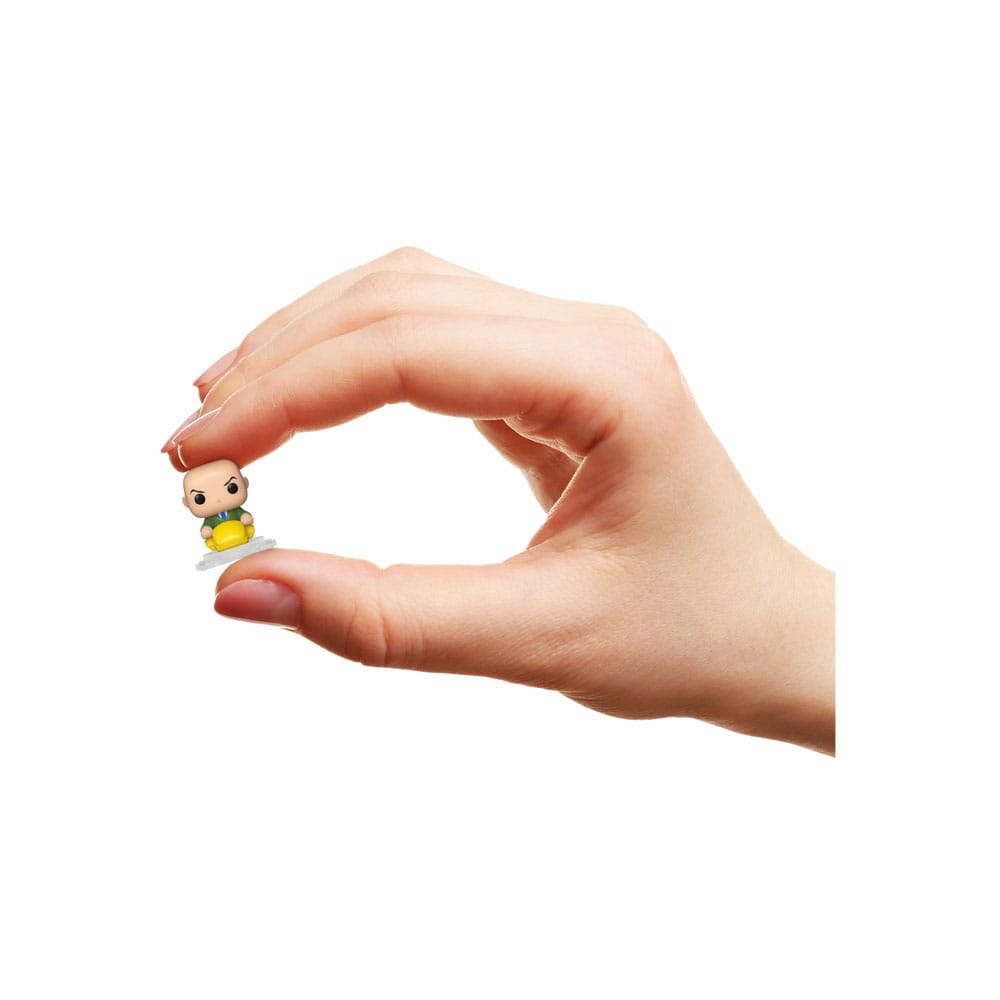 Hand holding a tiny X-Men Bitty POP! mini figure to show its size against the Xavier's School set