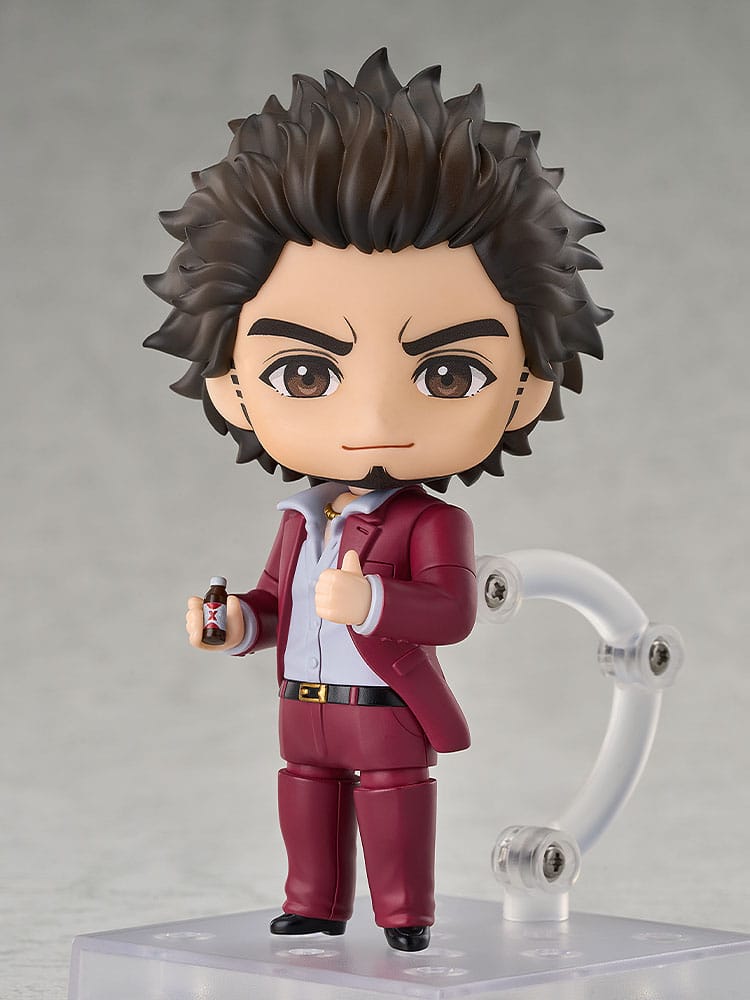 Ichiban Kasuga Nendoroid with contented face holding a small energy drink can