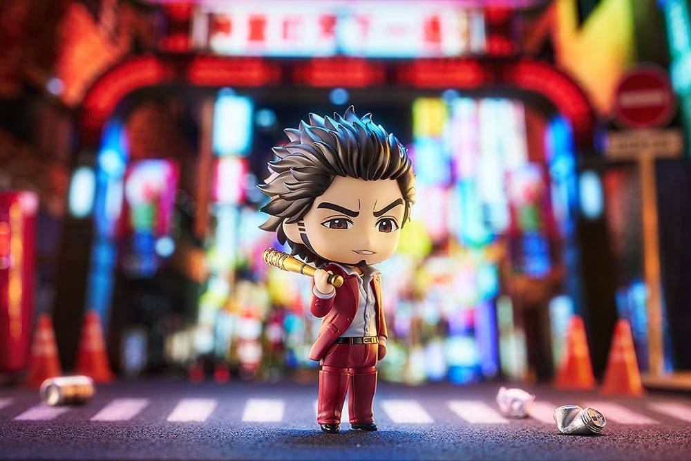 Ichiban Kasuga Nendoroid with bat in a neon-lit night street diorama
