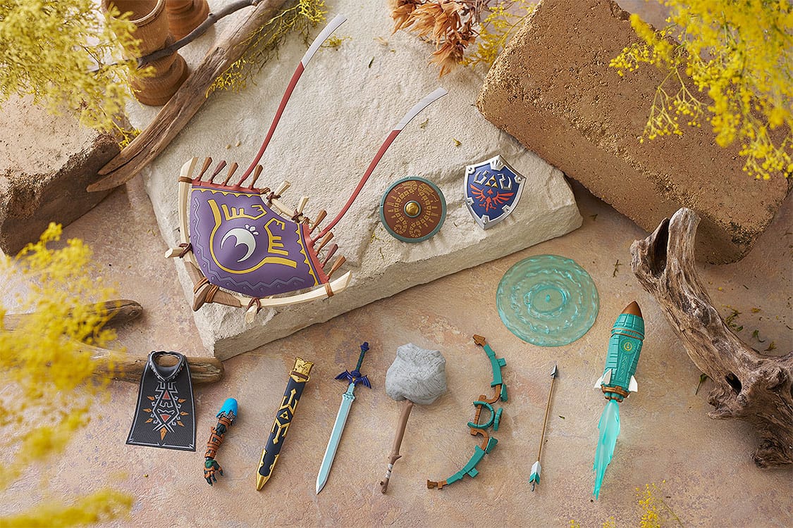 figma Link DX Edition accessories: Paraglider, shields, swords, bow and effect parts on a rustic scene