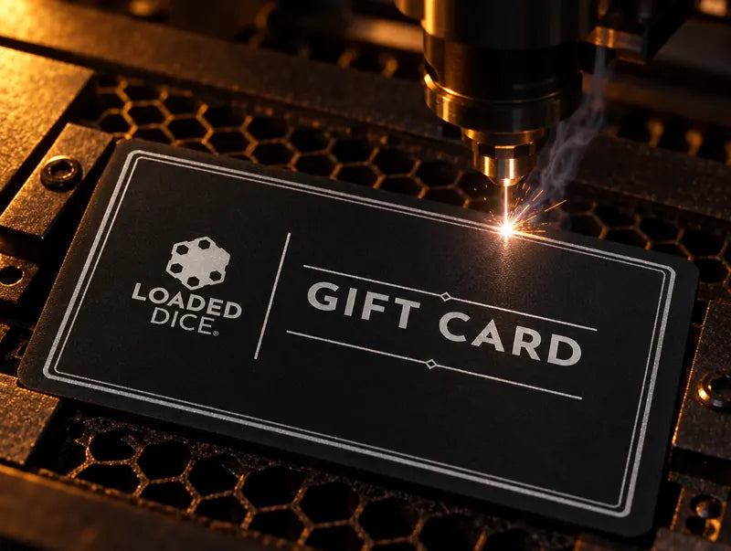 A laser engraving the black metal card